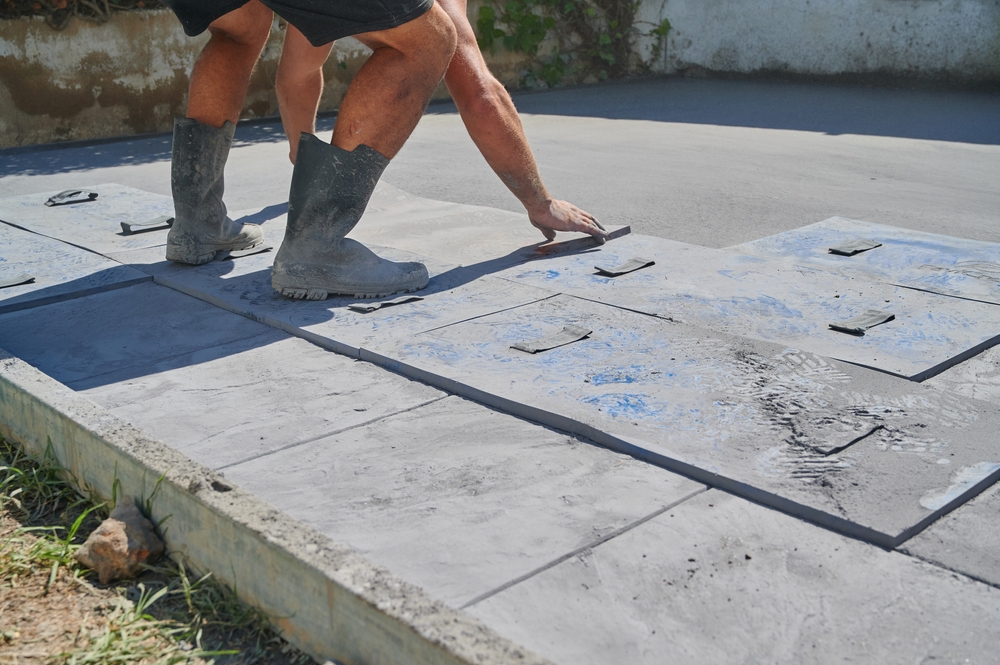 Why Stamped Concrete Wins on Durability and Price For Your Pool Deck