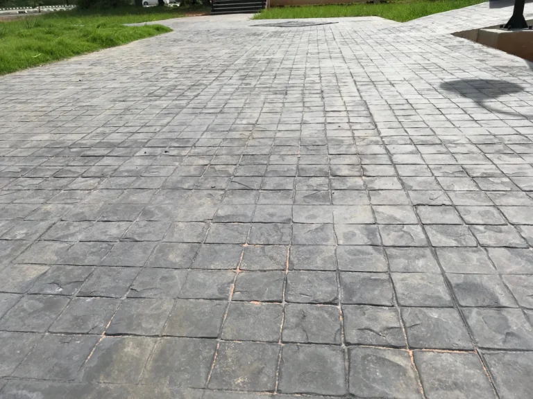 Stamped Concrete vs. Natural Flagstone: Cost, Maintenance, and Longevity in Freeze-Thaw Climates